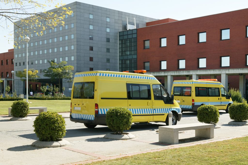 Ambulance vehicles on an hospital parking. Emergency transport
