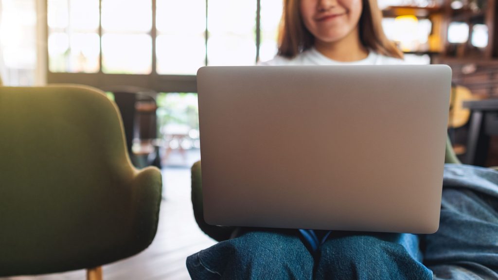 closeup-image-of-a-young-woman-using-and-working-o-RAC7M39