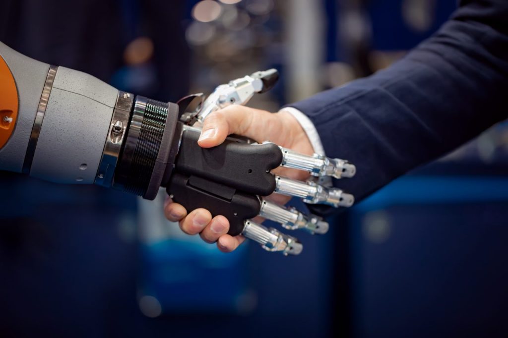 hand-of-a-businessman-shaking-hands-with-a-android-GYDH3MX-1024x682
