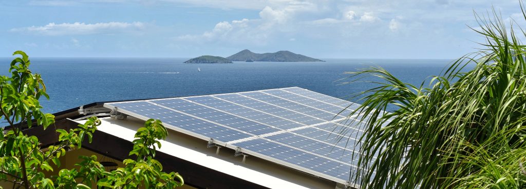 tropical-solar-energy-rooftop-panels-in-a-caribbea-JBZ2V4T