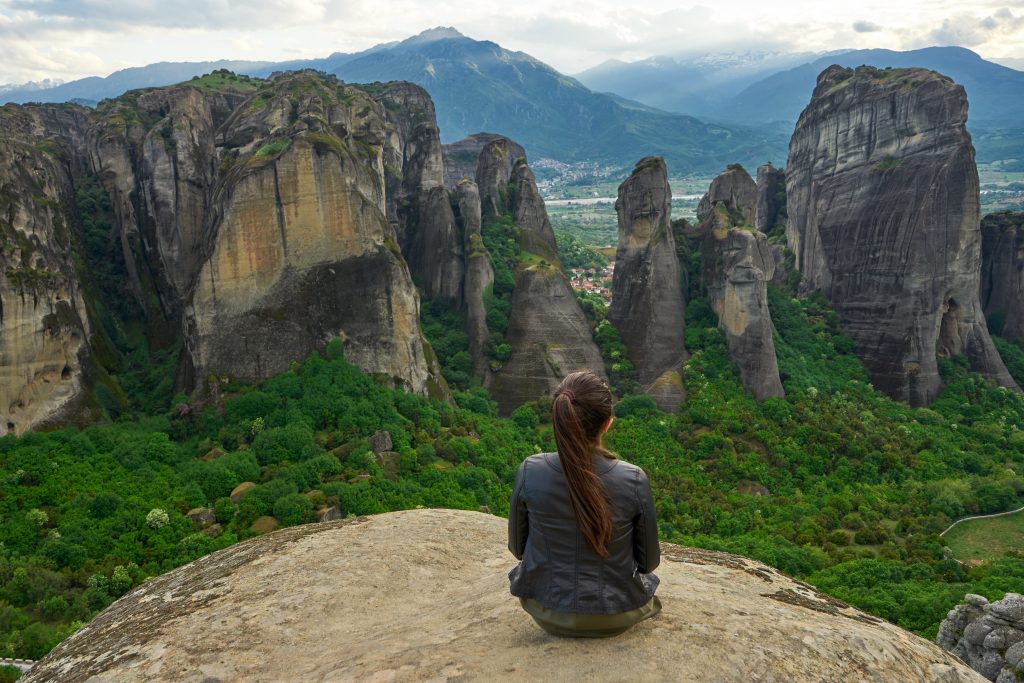 girl-enjoys-the-view-of-great-and-high-rock-in-met-PUR6TJ4