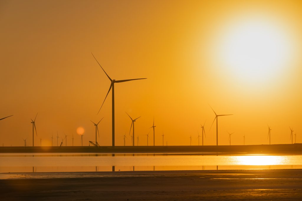 wind-turbines-on-the-seashore-at-sunset-green-ene-2021-08-29-17-32-47-utc