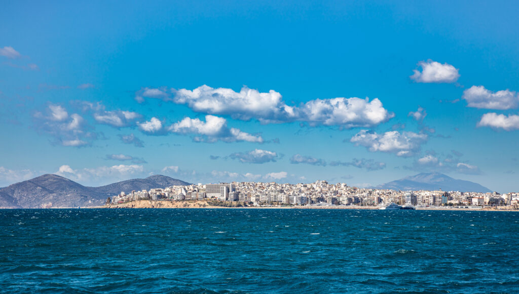 Blue sea and sky, Piraeus town background, Greece.