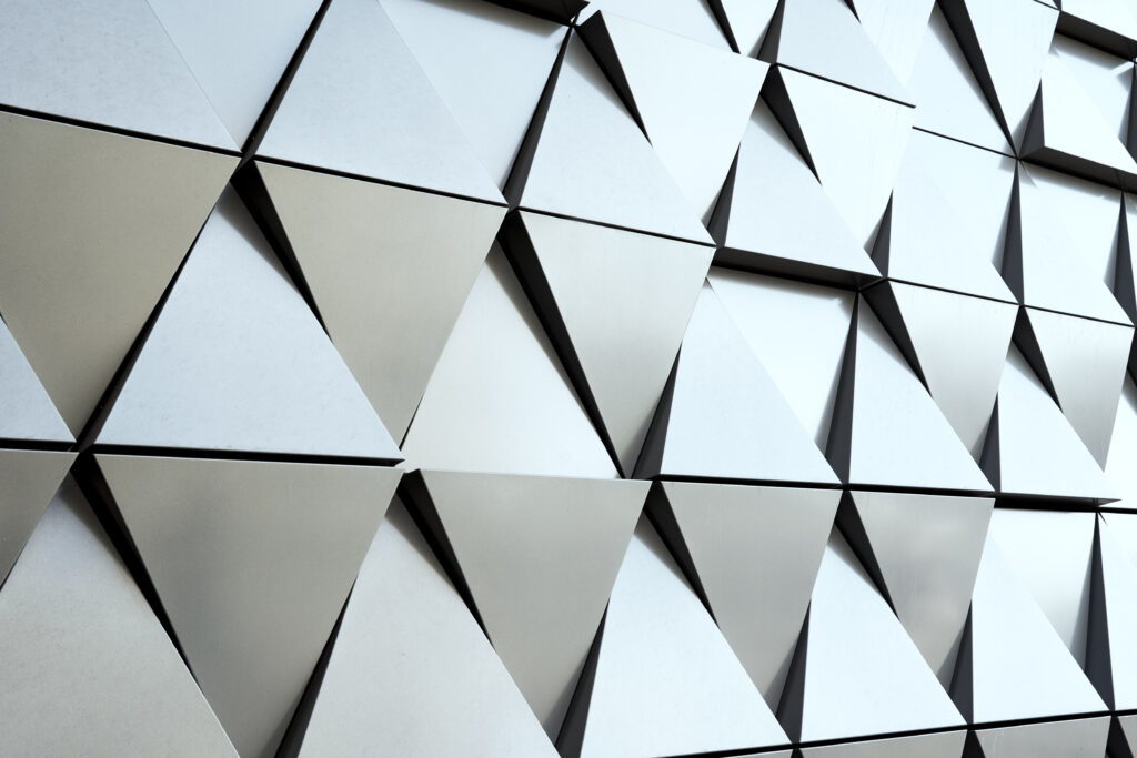 Abstract architecture detail. Gray wall facade with geometrical pattern