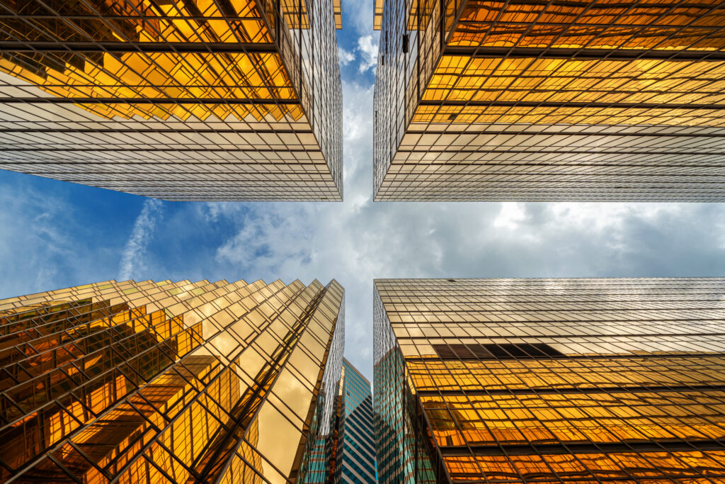 Uprisen angle of Hong Kong skyscraper with reflection of clouds